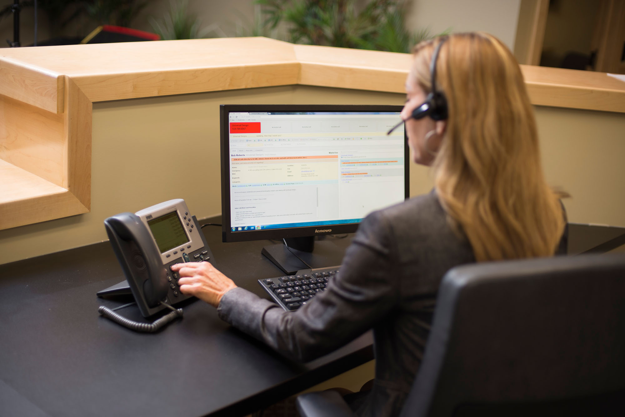 Professional receptionist answering calls at Chameleon Business Centres